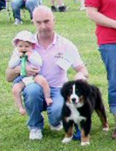 Baby Chloe at 10 Months with Dad Mervyn and Baby Amy at 12  Weeks in one of her First Fun Classes at the Bernese Mountain Dog Club of Great Britain  Garden Party  2007